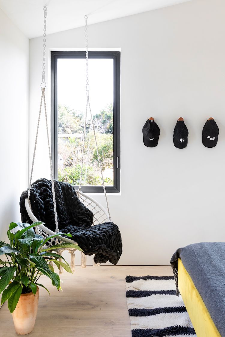 black-and-white child's room with hanging chair