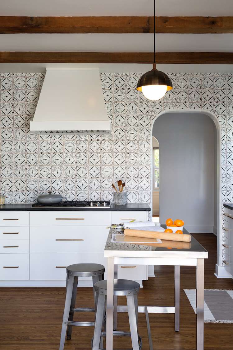 white kitchen cabinets with tiled backsplash walls