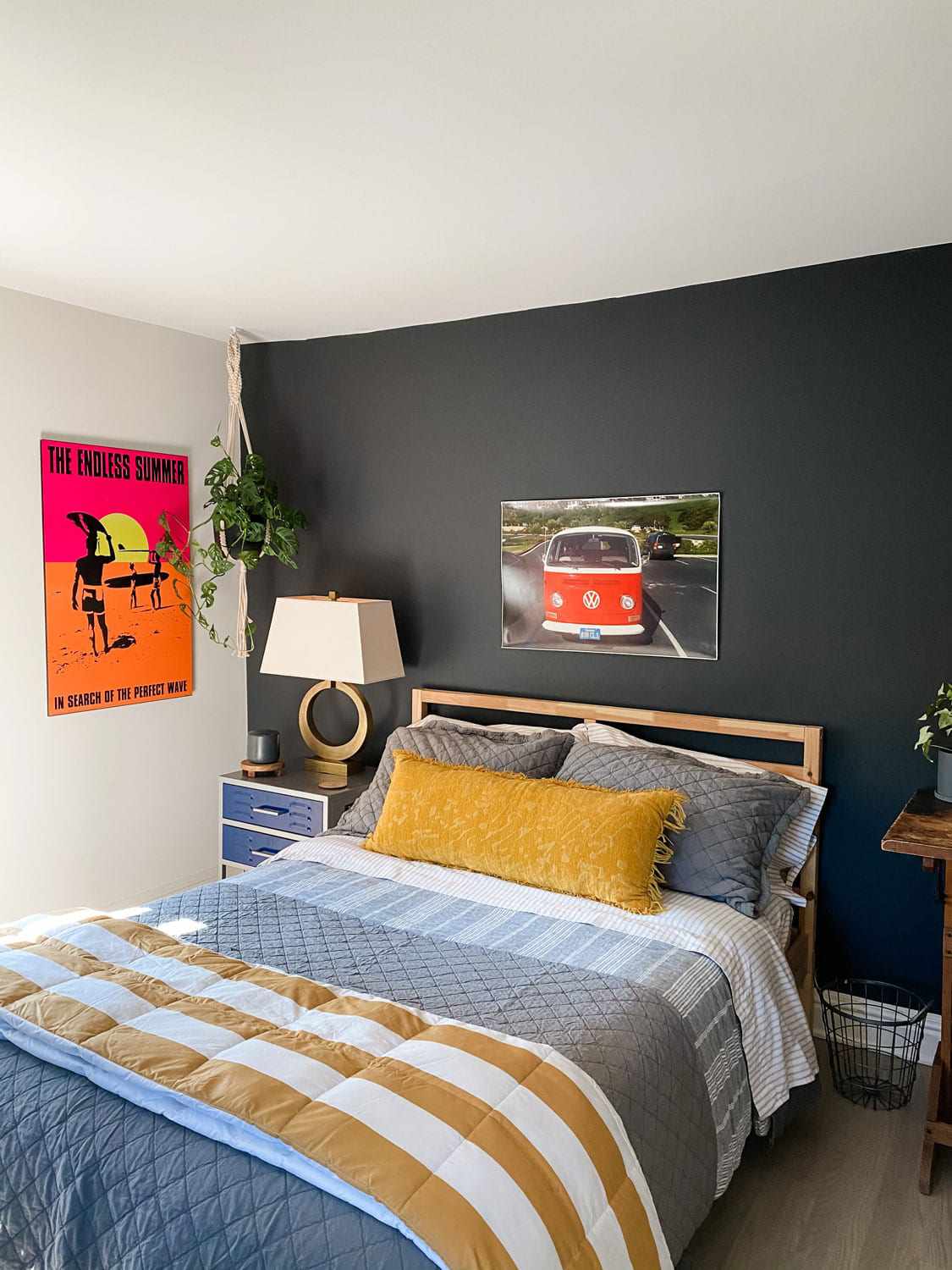 black accent wall in child's bedroom with white walls