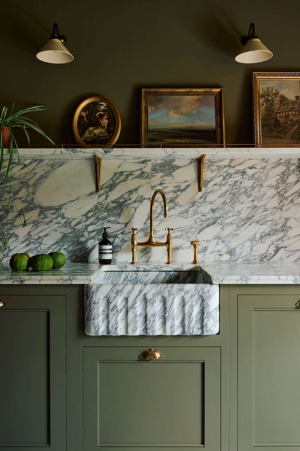 olive green kitchen cabinets with marble backsplash