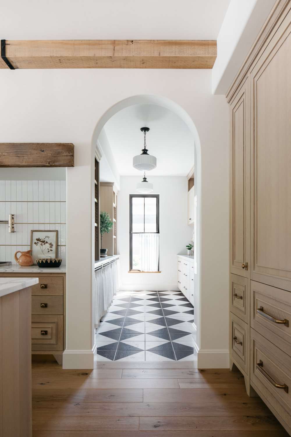 butler's pantry off kitchen with checkerboard flooring