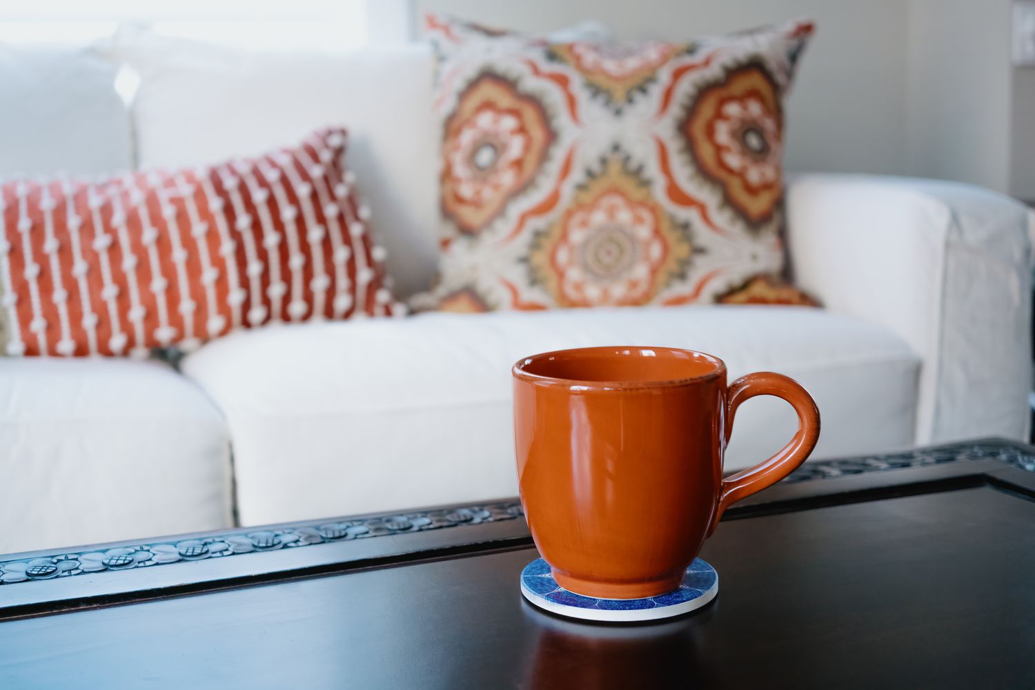 mug on coaster on coffee table