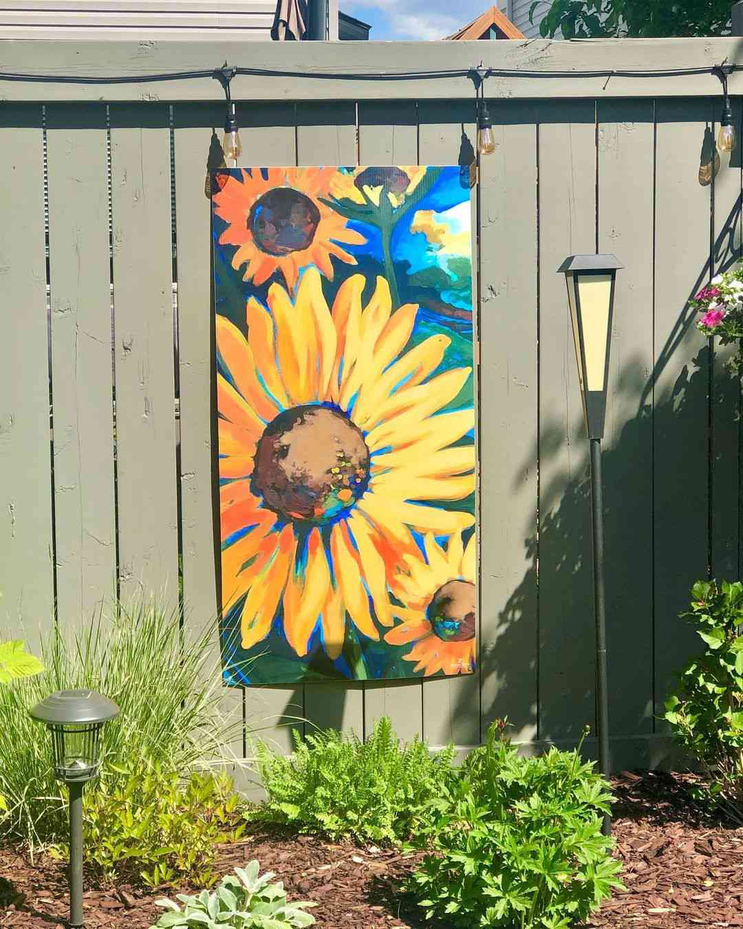 solrosdesign på staket
