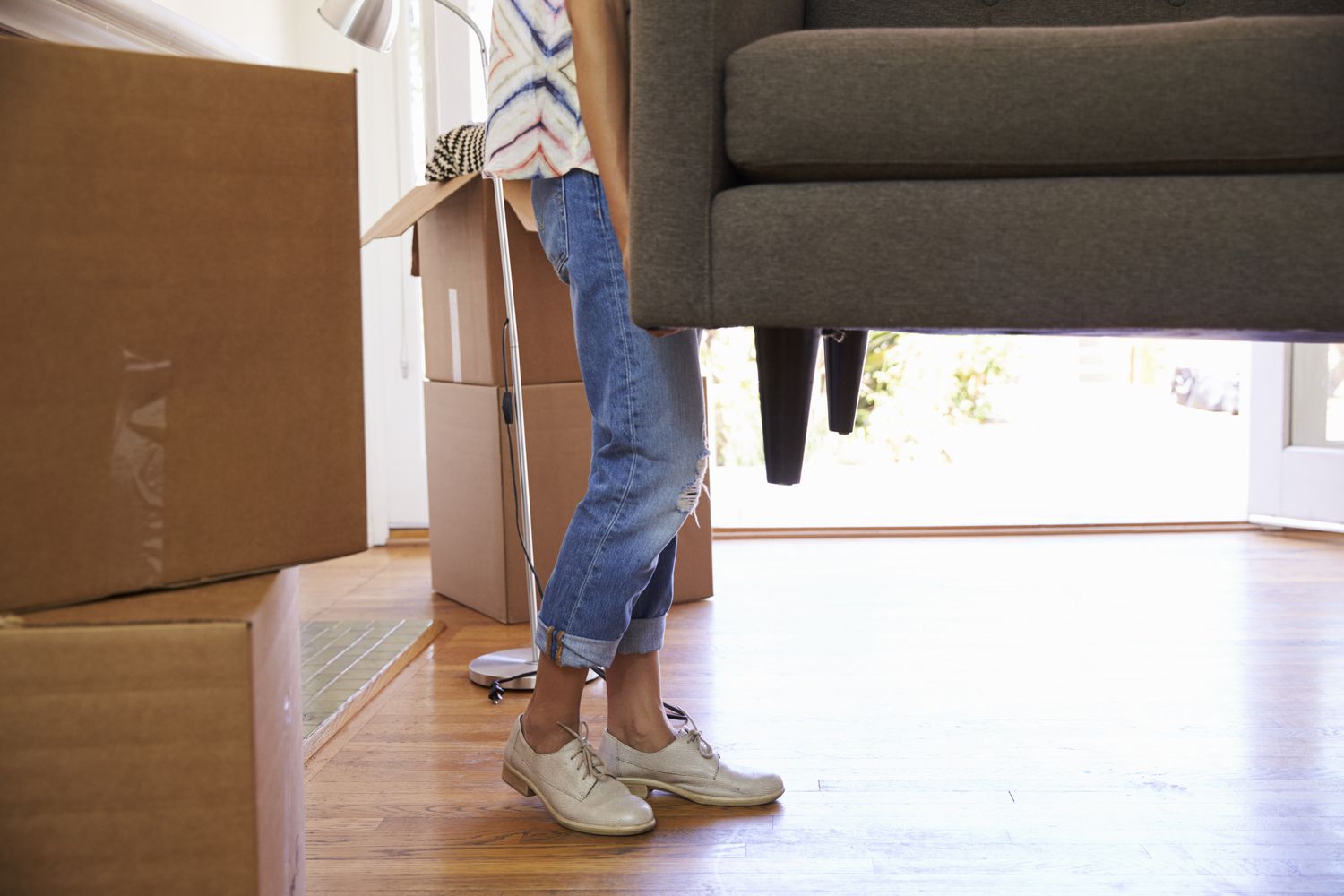 person lifting sofa