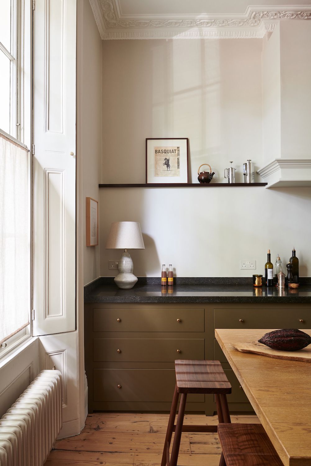 olive green kitchen base cabinets with black countertops