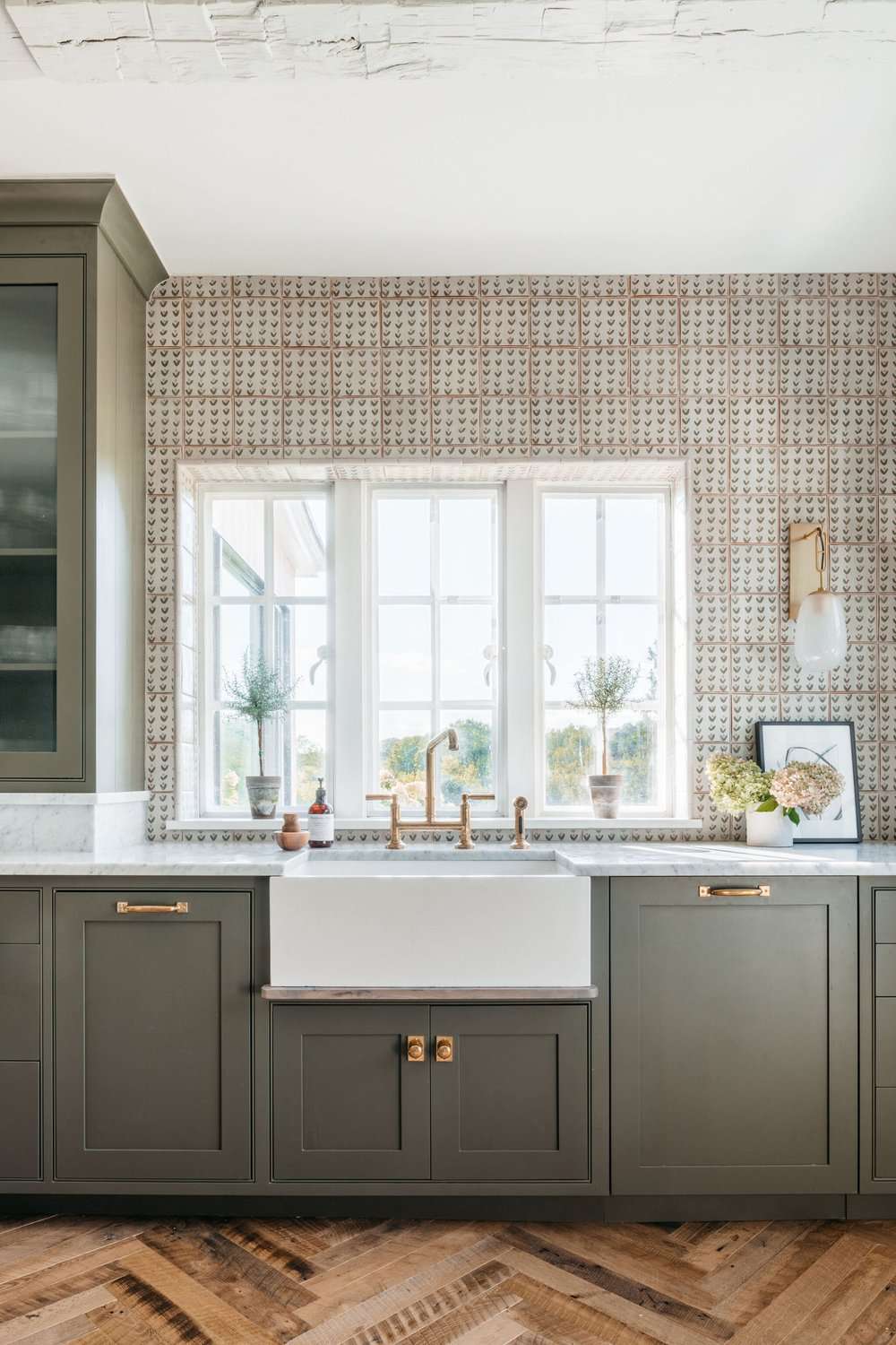 benjamin moore dark olive kitchen cabinets with patterned tile backsplash