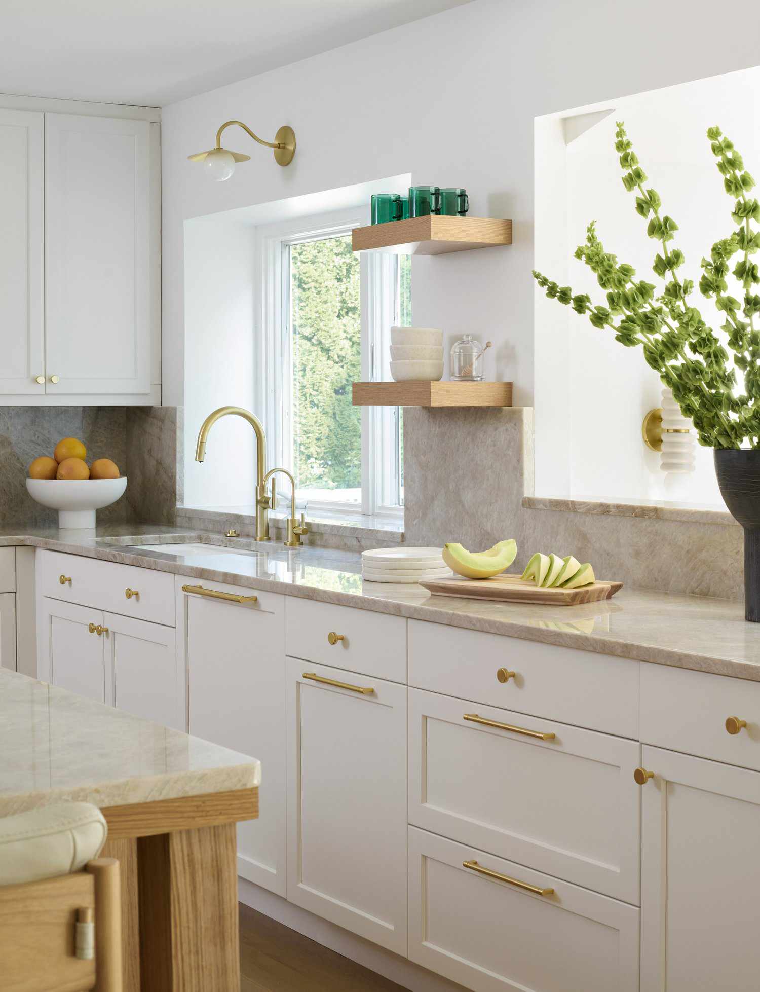 white kitchen cabinets with polished brass hardware