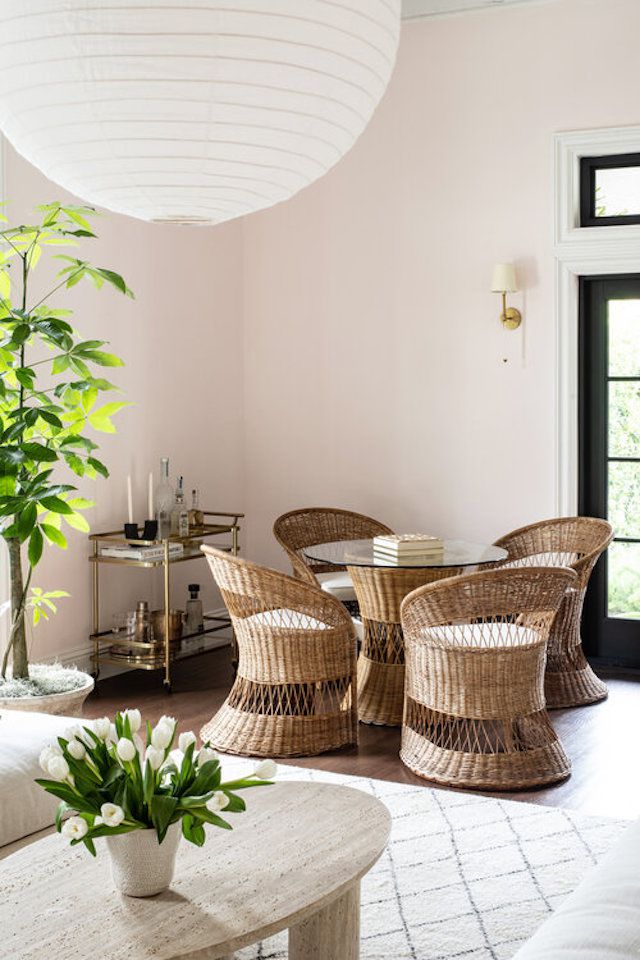 Dining room with a brass bar cart