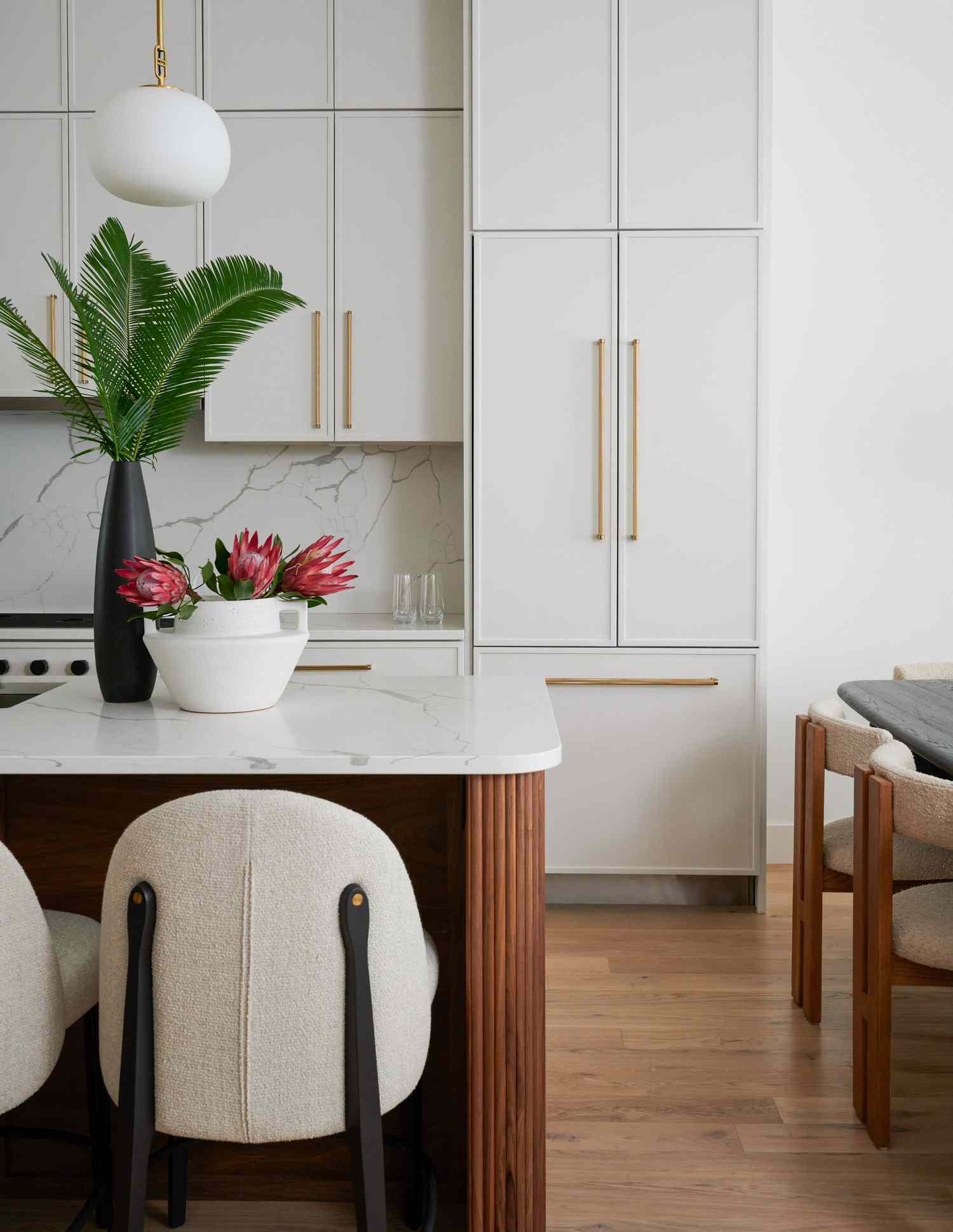 white kitchen cabinets with extra long pulls