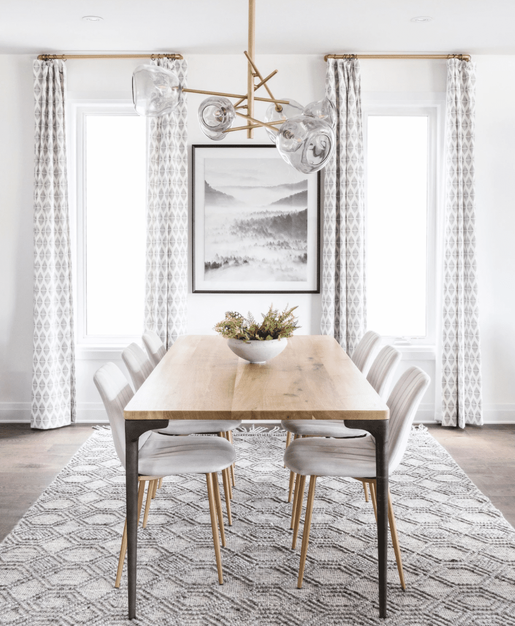 modern dining room with gray and white curtains